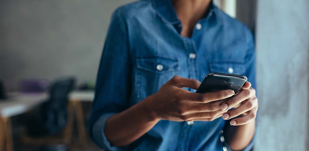 woman holding phone in hands