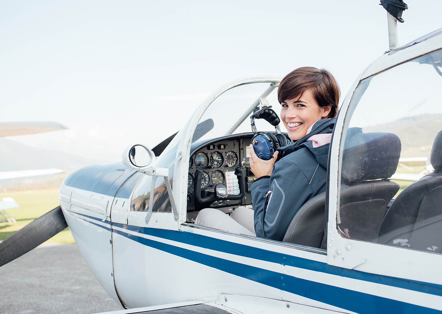 Pilot in aircraft cockpit of small plane