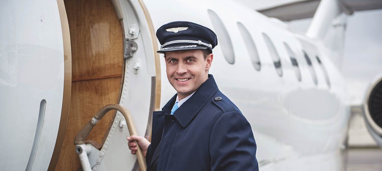 bigstock-Portrait-Of-Beaming-Pilot-Ente-228313294 Pilot boarding a plane