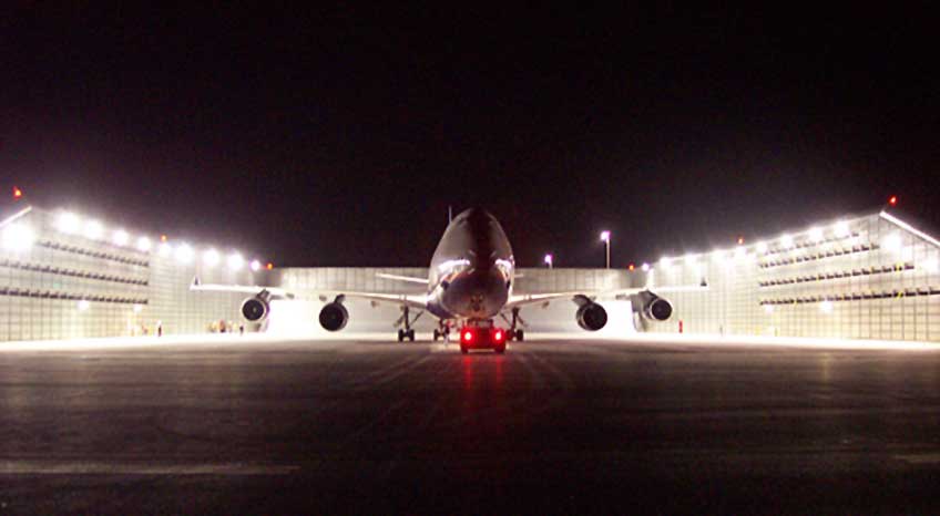 Airplane by noise blocking wall