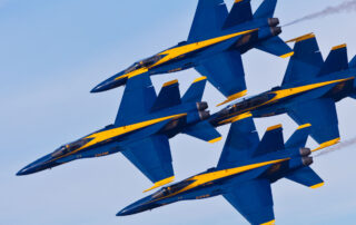 four blue angels in formation