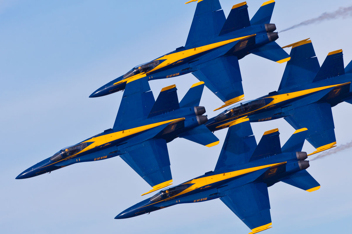 four blue angels in formation