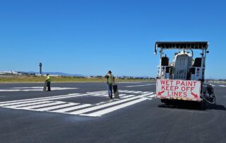 taxiway repair work with wet paint sign