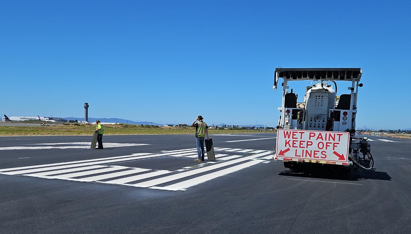 taxiway repair work with wet paint sign